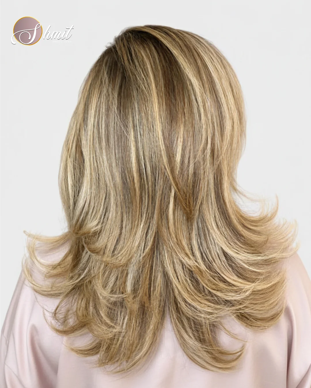 Melena rubia con balayage, capas y volumen realizada en peluquería Madrid
